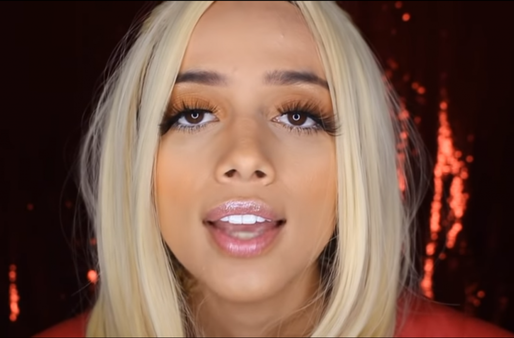 Sabrina Asmr in a sexy red latex outfit as a Dominatrix asmr artist
