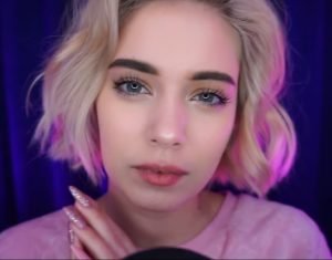 "bilochka asmr" in a purple outfit.