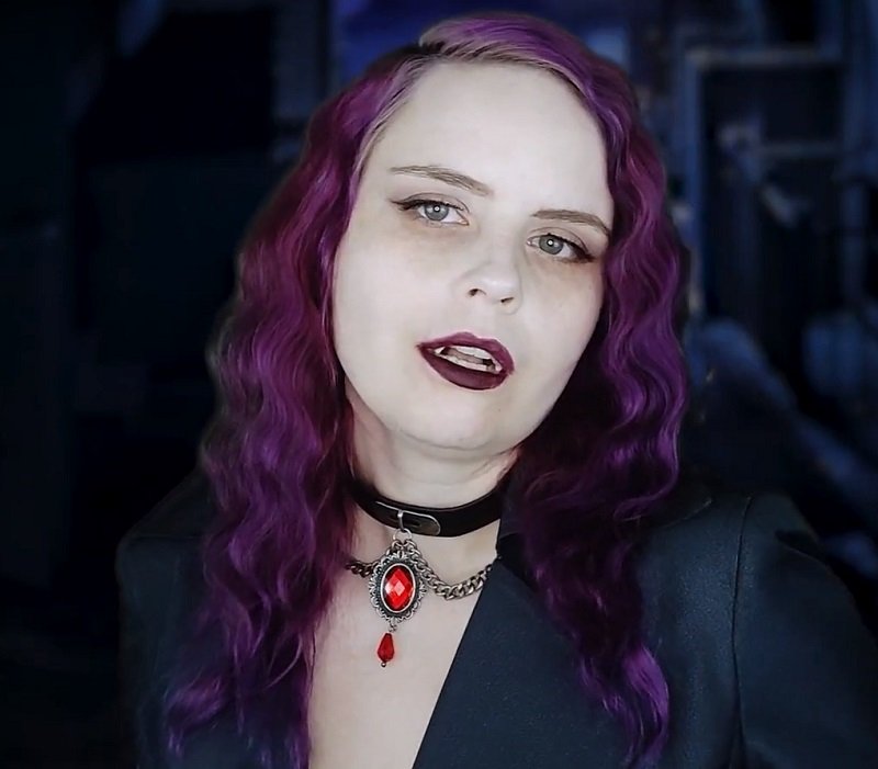 "Lady Dimitrescu Role Play" with dark purple hair.
