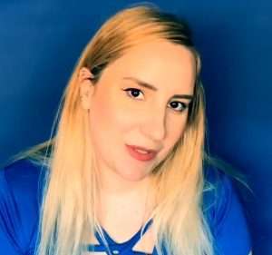 "bluezzz asmr" in a blue shirt with blonde hair.