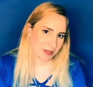 "bluezzz asmr" in a blue shirt with blonde hair.