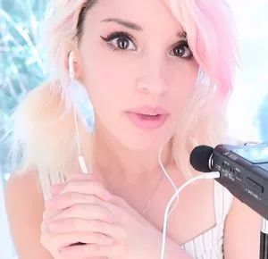 "cherry crush ASMR" with blonde hair and a white top.