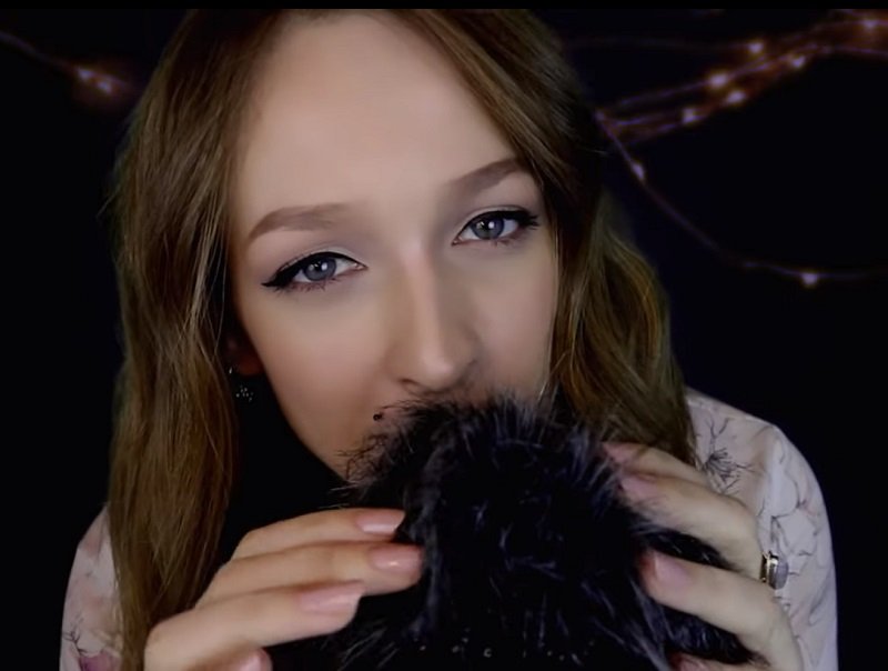 "iWhisper Asmr" blowing in a microphone.