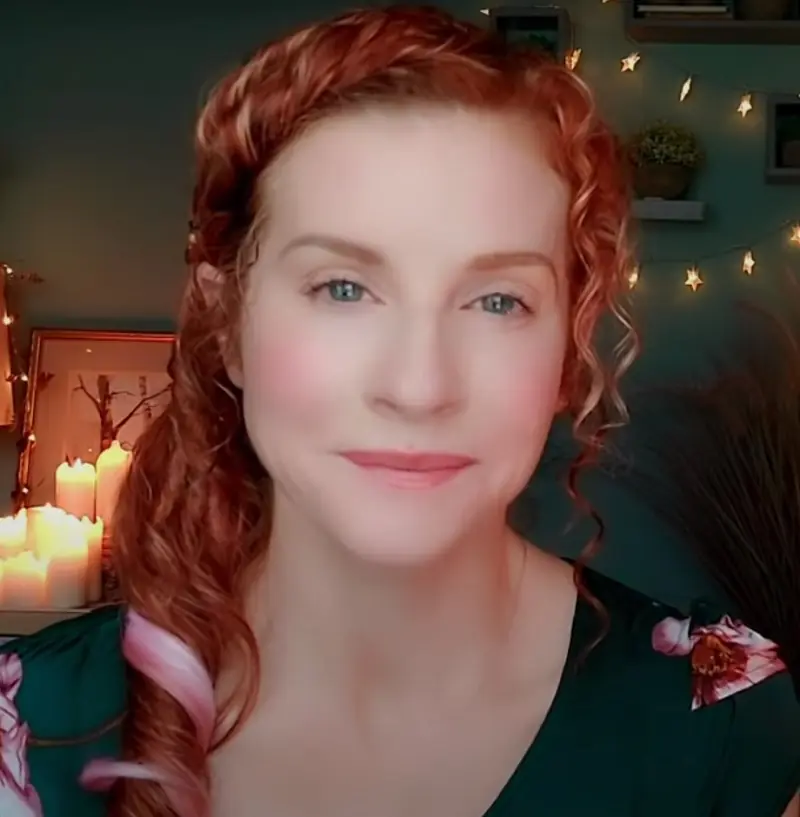 "The ASMR Psychologist" with red hair and a lovely glow.