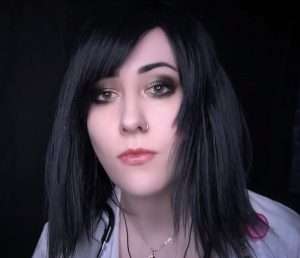 "Luna Eclipse ASMR" with black hair doing a medical role play.