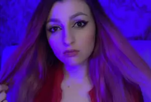 "Olchonok ASMR" with her pink hair spread apart