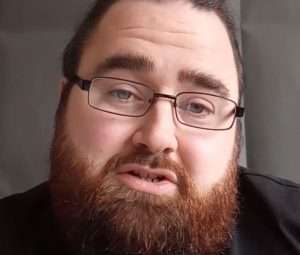 "Northern Rob ASMR' A male ASMR artist with a beard.