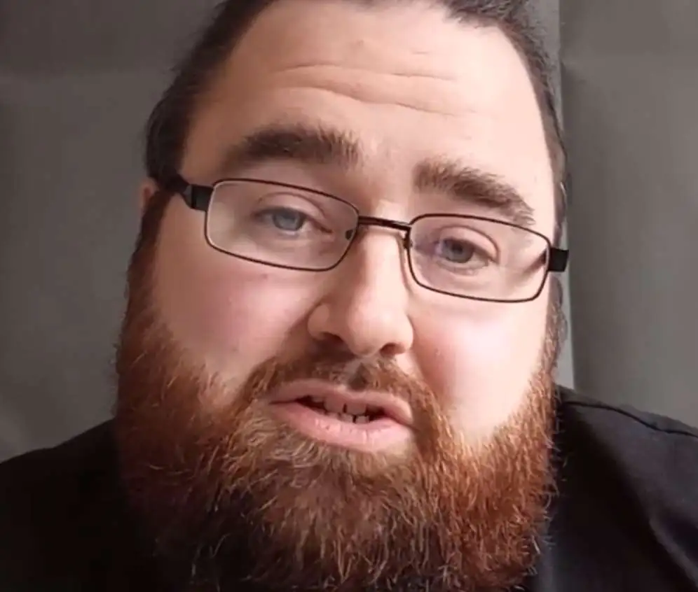 "Northern Rob ASMR' A male ASMR artist with a beard.