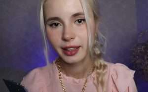 "Kotlettik ASMR" one of the most beautiful ASMR artists in the world in a pink dress.