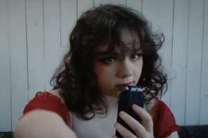 Ange ASMR in a red outfit