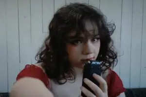 Ange ASMR in a red outfit
