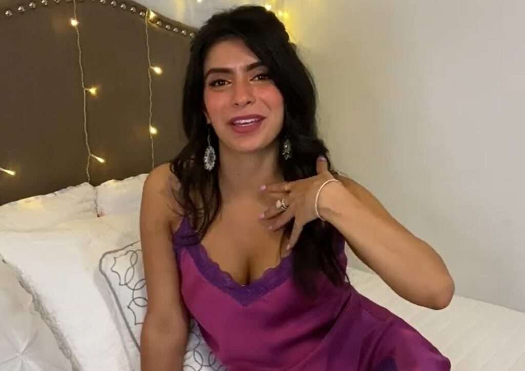 corneliusthecat latina asmr creator wearing headphones and teasing the mic