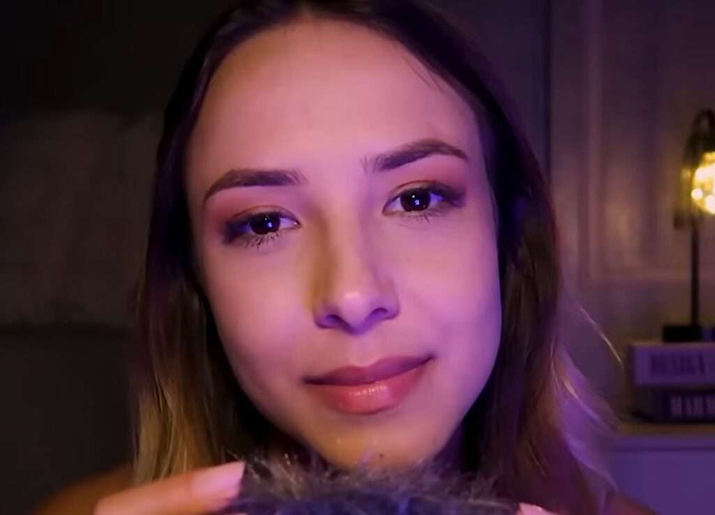 Larissa Volpati giving ASMR in a fluffy microphone