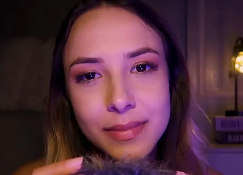 Larissa Volpati giving ASMR in a fluffy microphone
