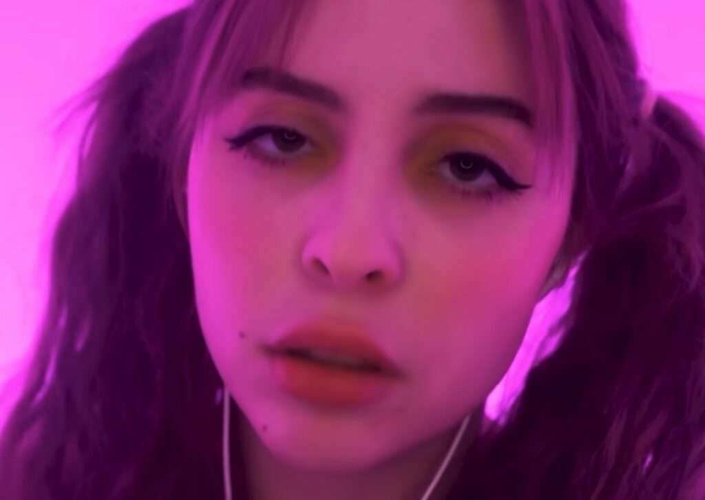 moona asmr artist with gentle smile and cozy room background