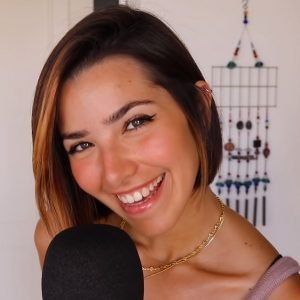 ASMR Glow "ASMR Glow" smiling in front of a microphone