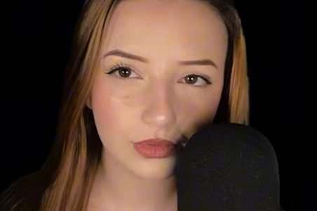 Anyala ASMR giving personal attention ASMR into a microphone.