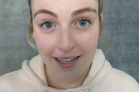 "Idyllic ASMR" wearing a white hoodie