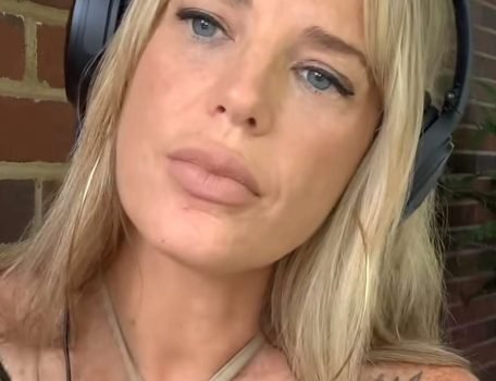 Lucy ASMR "Lucy ASMR" with blonde hair and tilted head.