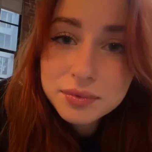 what-is-personal-attention-asmr red haired asmr artist performing personal attention asmr